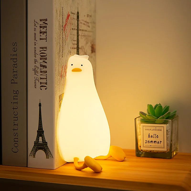 Tired lying duck nightlight also doubles as cellphone stand